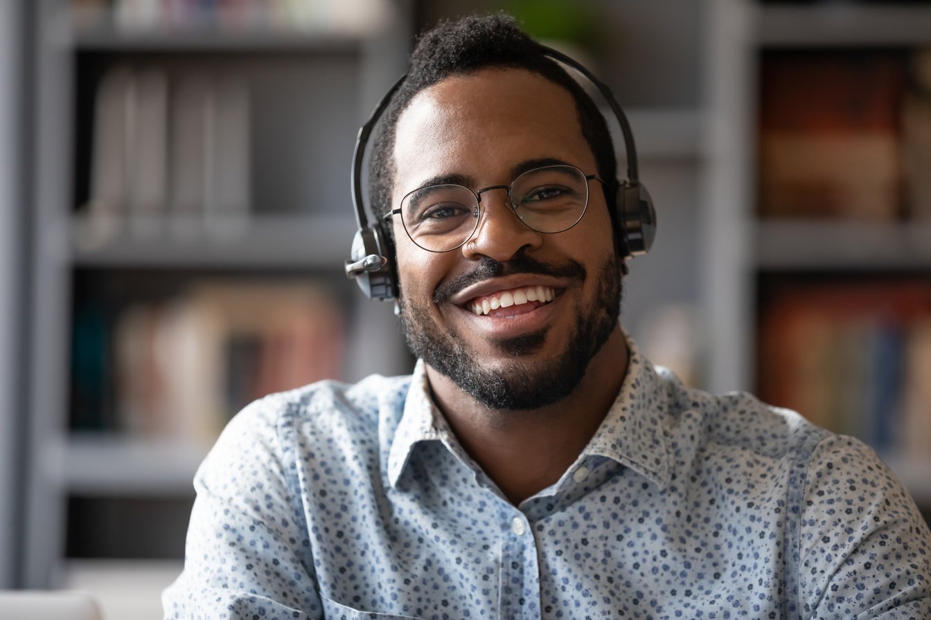 Portrait of smiling biracial male call center agent